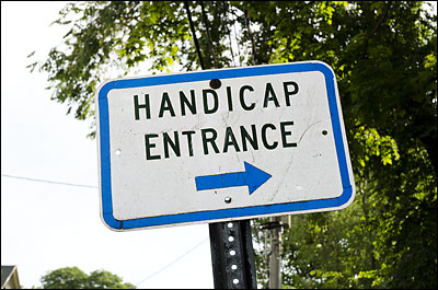 Handicap Entrance sign by Washington Square entrance to Abbot Hall.
