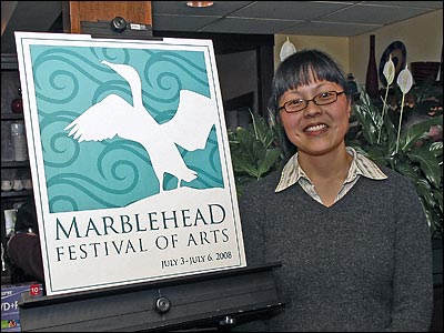 Susan Lee with winning logo at the Logo Premiere.