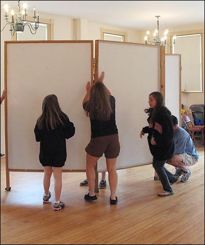 Setting up art exhibits flats.